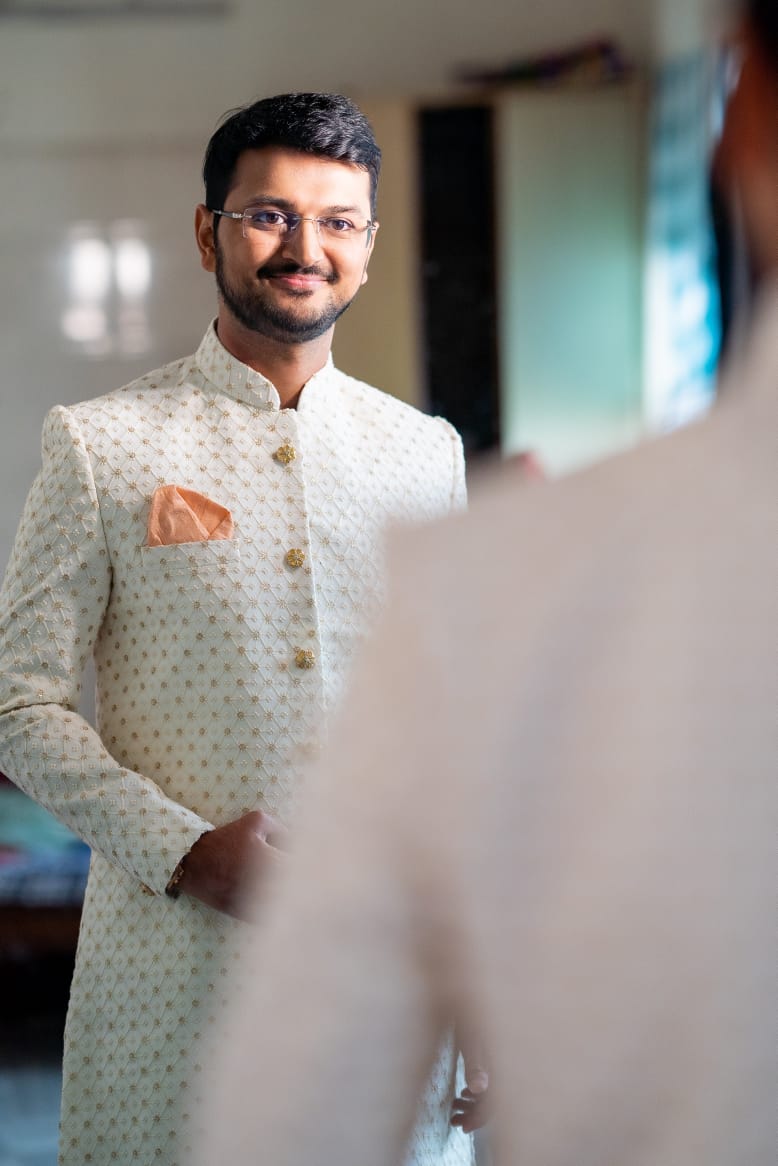 Manav Ethnic Happy Customer wearing a White Indo Western