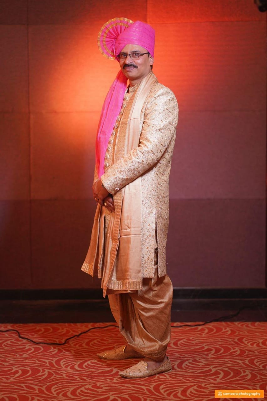 Manav Ethnic Happy Customer wearing a Golden Indo Western